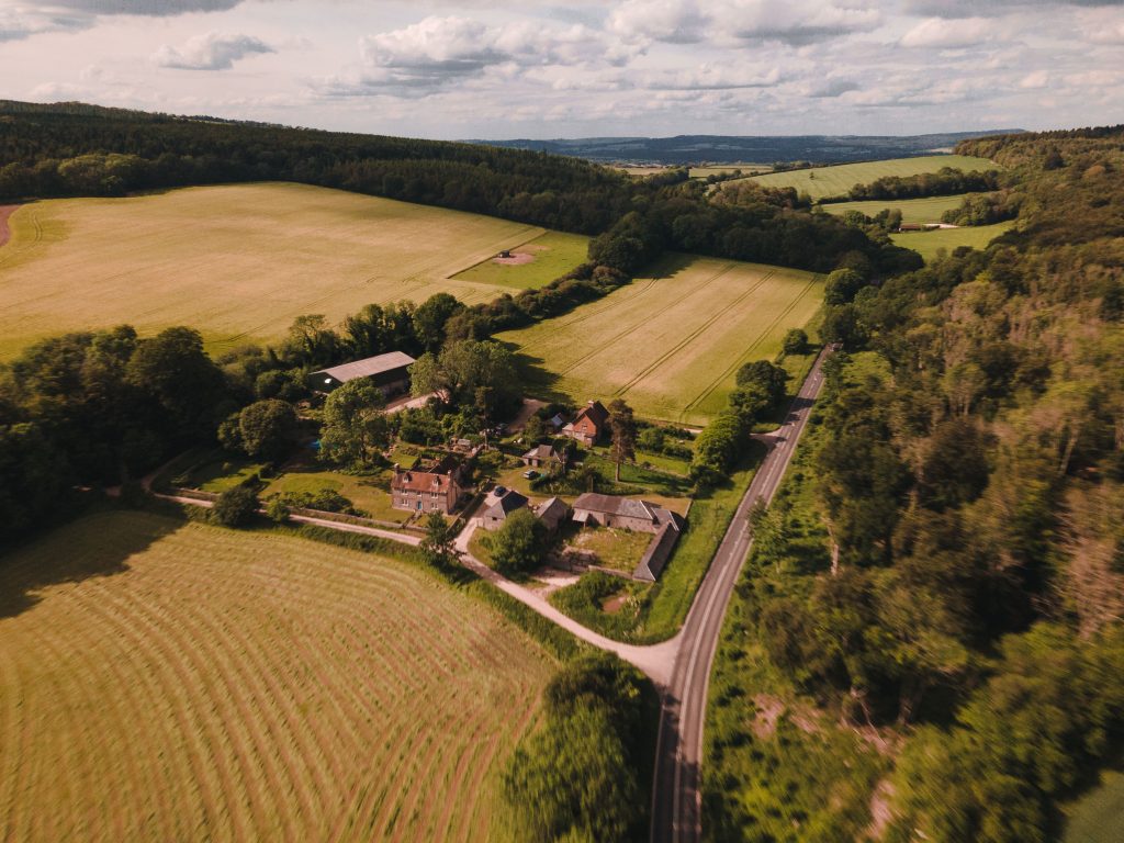 Aerial surveying drone capturing topographic data over open land