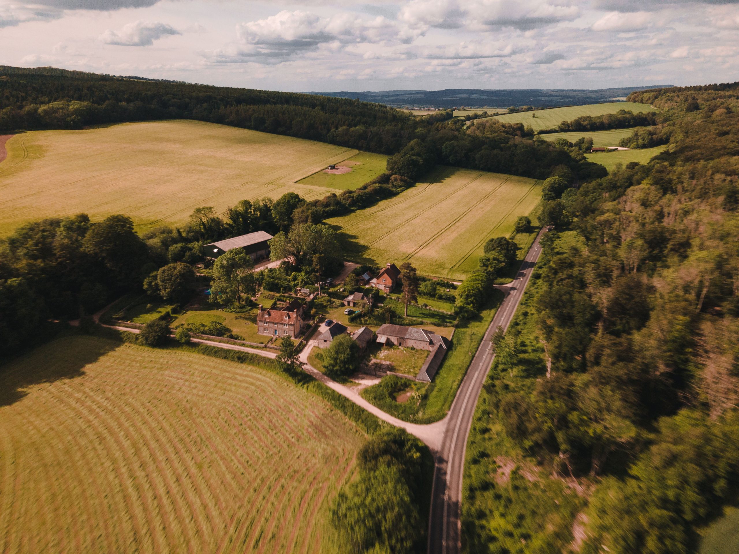 Aerial surveying drone capturing topographic data over open land